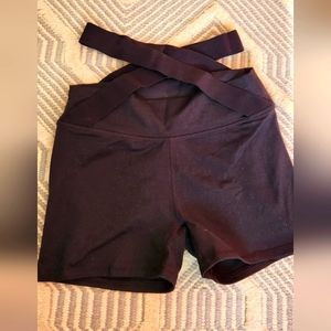 Black fabletics biker Jordana high waisted shorts with straps at waist band. S
